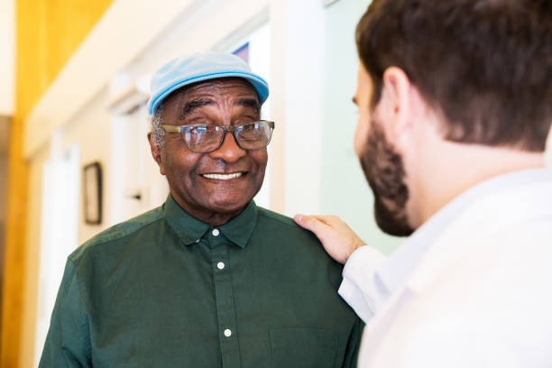 Doctor giving good news to patient in hospital