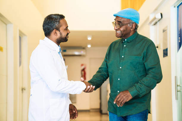 istock Doctor handshaking with patient in corridor 1140327470