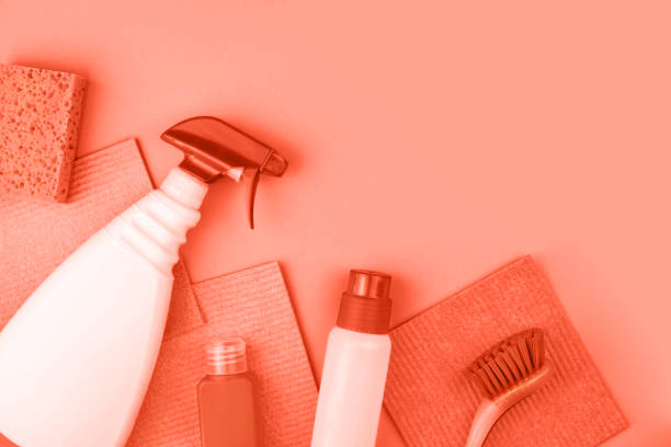 istock House cleaning products are on coral background. 1140328382