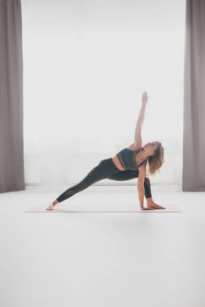 istock Young woman in Crescent Lunge pose 1140328737