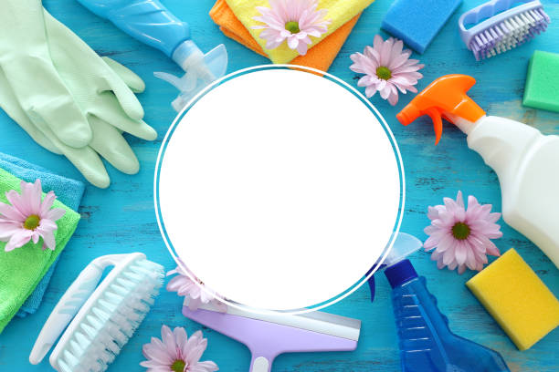 istock Spring cleaning concept with supplies over blue wooden background. Top view, flat lay 1140329963