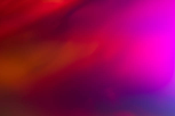 blur red lens flare glow Illuminated bokeh Blurred pink and red abstract lens flare background. Defocused glow effect. Illuminated bokeh aurora borealis photos stock pictures, royalty-free photos & images
