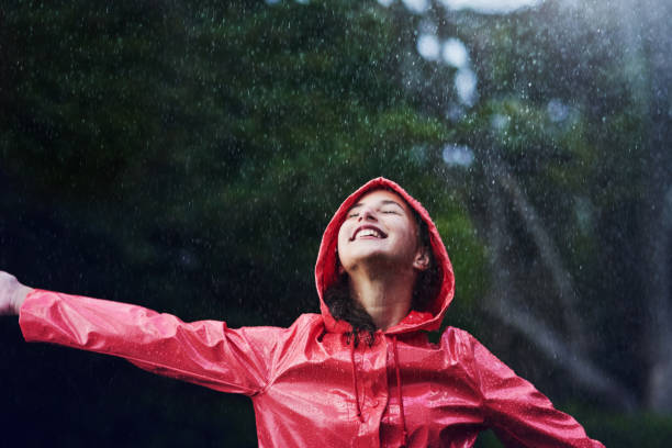 make rainy days fun filled days - coat warm clothing one person joy imagens e fotografias de stock