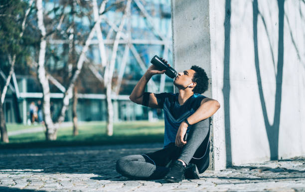 istock Sportsman drinking water after training 1140331914