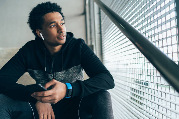 istock Male athlete with smart phone 1140331931