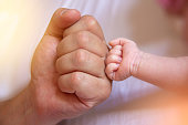 Father give baby fist
