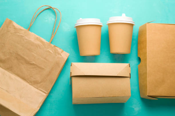 istock flat lay recyclable types of paper  packaging on a blue background 1140332927