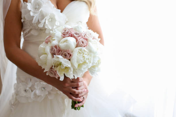 istock Bride holding her wedding bouquet 1140334084