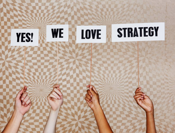 istock Raised hands hold sigs 