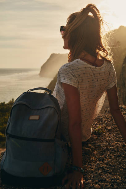 istock Tourist girl with backpack enjoying the view. 1140335408