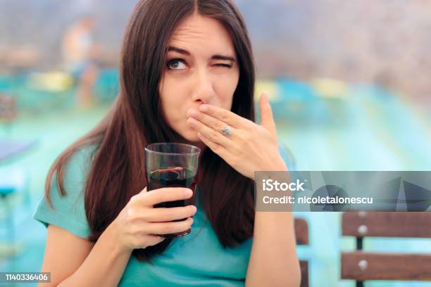 Woman Reacting After Having A Fizzy Soda Drink Stock Photo - Download Image Now - Hiccup, Burping, One Woman Only