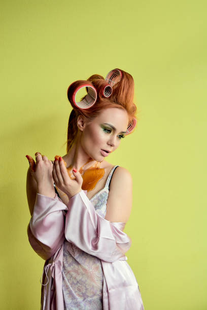 istock Young redhead woman with shugaring paste on her hands, face, body and chest. 1140336577