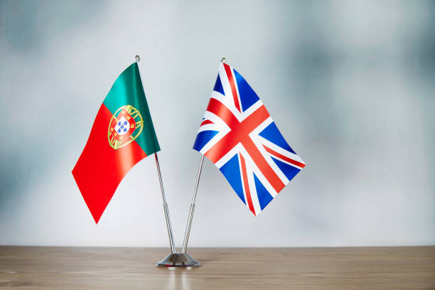 english and portuguese flag standing on the table - british flag freedom photography english flag imagens e fotografias de stock