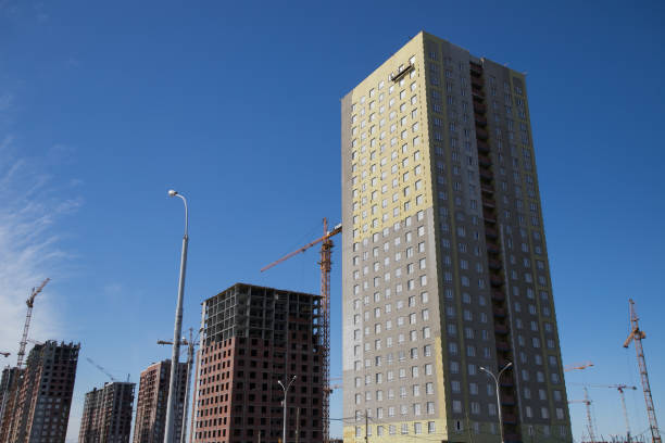 istock Construction of a multi-storey residential complex. Crane near the building under construction. Background construction site. 1140338840
