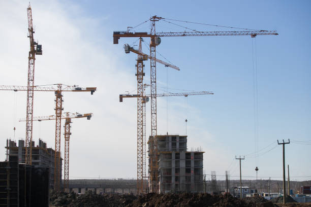 istock Lots of tower Construction site with cranes and building with blue sky background 1140338970