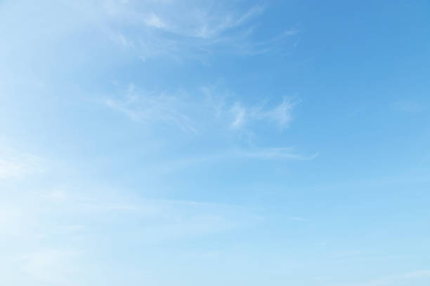 istock Beautiful clear blue sky background with plain large white cloud on morning time rays sunlight. space for text. soft focus. 1140343263