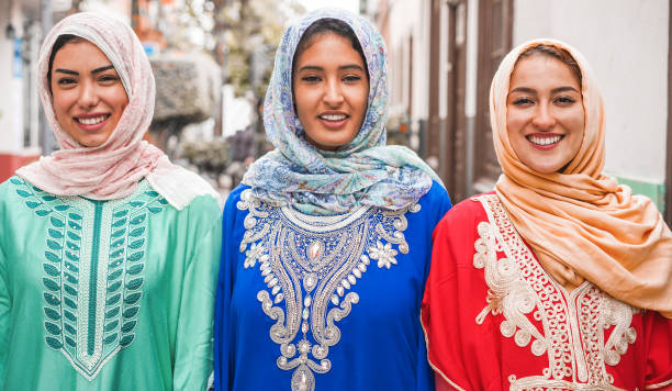 Portrait of arabian girls outdoor in city street - Young islamic women smiling on camera - Youth, friendship, religion and culture concept - Focus on faces Portrait of arabian girls outdoor in city street - Young islamic women smiling on camera - Youth, friendship, religion and culture concept - Focus on faces moroccan woman stock pictures, royalty-free photos & images
