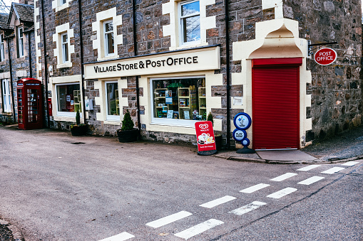 The Village Store and Post Office on the south west side of The Square in the highland village of Tomintoul in the Grampians of Scotland.