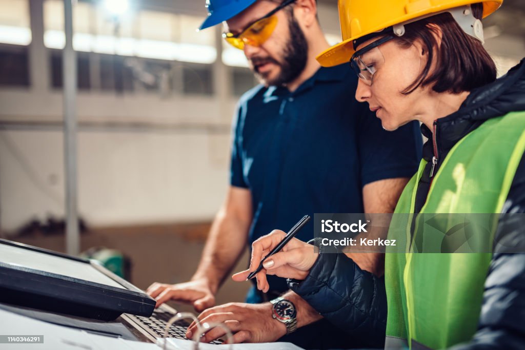 Cnc Machine Operator And Industrial Engineer Typing Fabrication Program ...