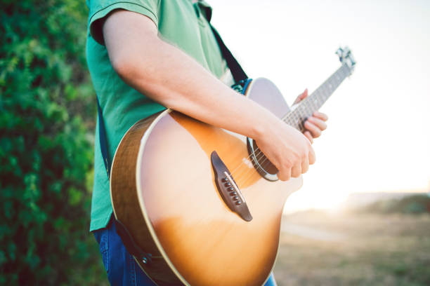 istock Male musician with his guitar 1140353969