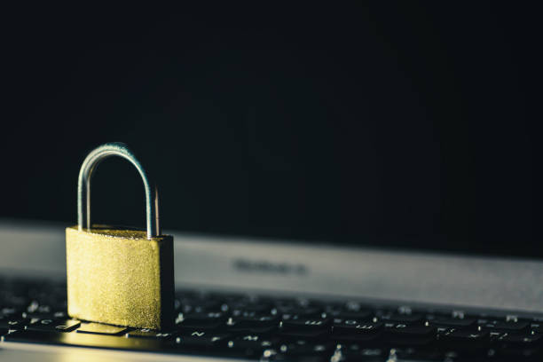 istock Padlock on laptop against dark background. Internet data privacy information security concept. 1140354018