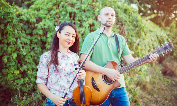 istock Musicians with guitar and violin 1140354143