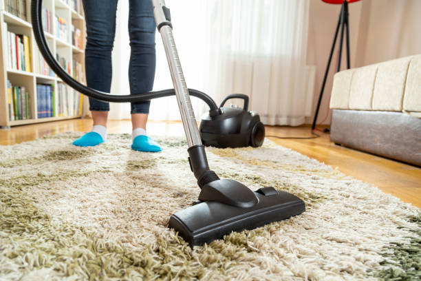 istock Woman vacuuming floor 1140355699