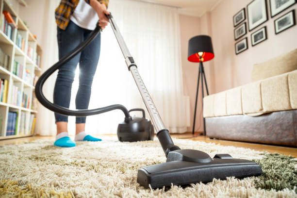 istock Woman vacuuming the carpet 1140355724