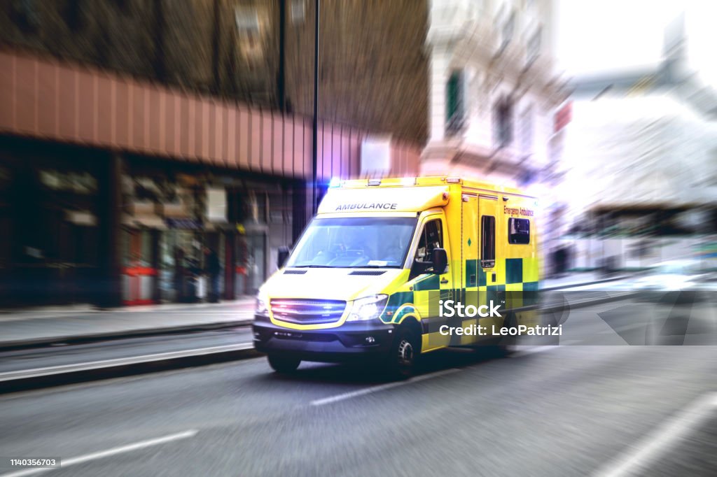 Ambulance respond to an Emergency in downtown Ambulance Stock Photo