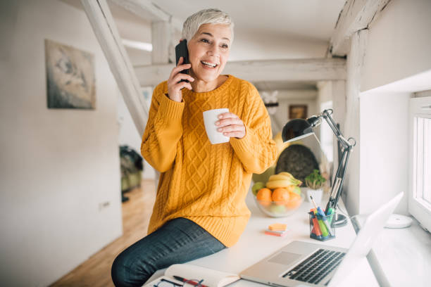 istock Happy woman talking on phone 1140359471