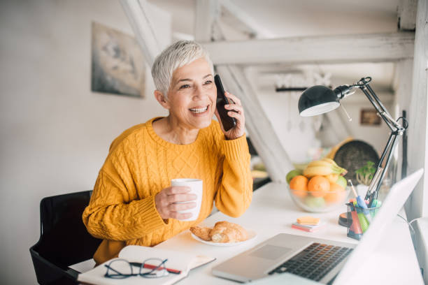 istock Woman drinking coffee and talking on phone 1140359617
