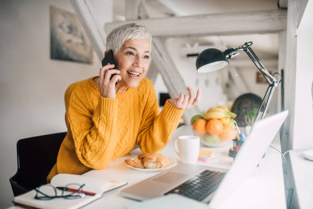 istock Mature woman talking on phone 1140359667