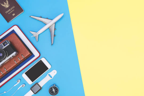 istock travel objects and accessories on blue yellow background with passport camera and plane 1140363231