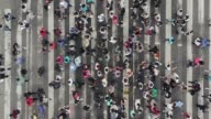 istock Aerial view of pedestrians walking across with crowded traffic 1140364351