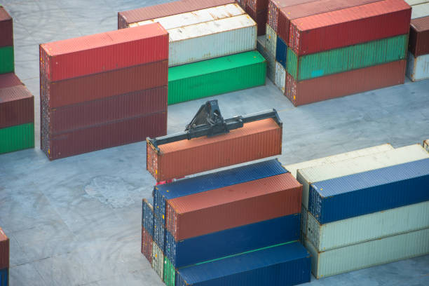 istock Container ship in export and import business logistics and transportation. Cargo and container box shipping to harbor by crane. Water transport International. Aerial view and top view. 1140364619