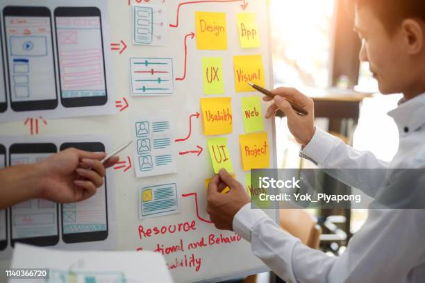 Ux Designer Creative Group Working About Planing Mobile Application Project With Sticky Notes User Experience Concept Stock Photo - Download Image Now