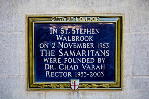 London, UK - February 15th 2019: A plaque on the exterior of St. Stephen Walbrook Church in the City of London, detailing where The Samaritans were founded in 1953.