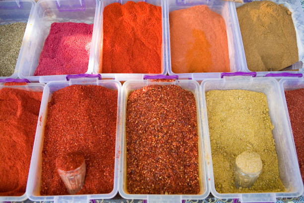 istock Multi-colored seasonings in containers on the counter. 1140368555
