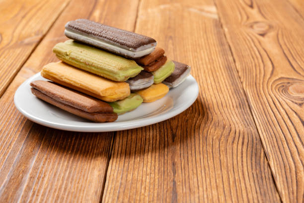 istock multicolor sandwich cookies on a wood table with copy space 1140370110