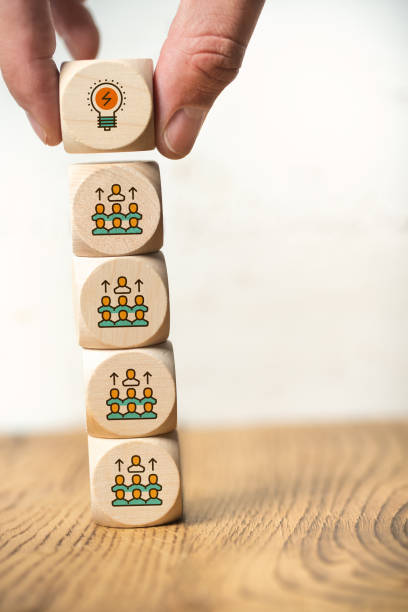 istock many people together having an idea symbolized by icons on cubes 1140370239