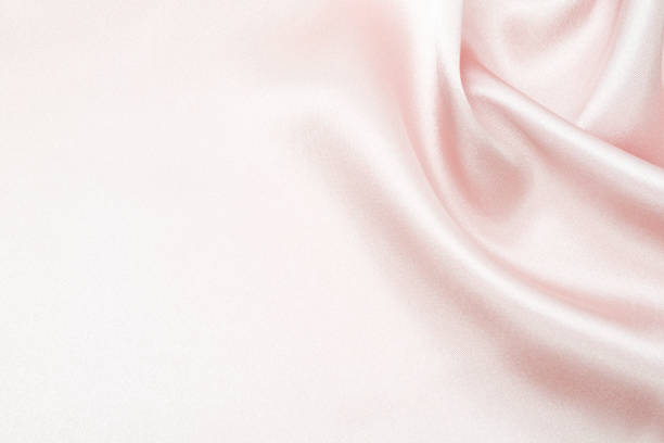 istock Charming smooth satin and silk pink fabric for backgrounds. Elegant abstract upholstery use for holidays 1140373163