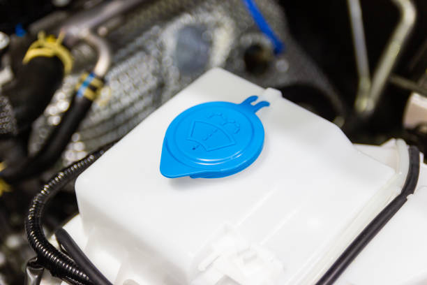 closeup new windshield washer water tank in the car engine
