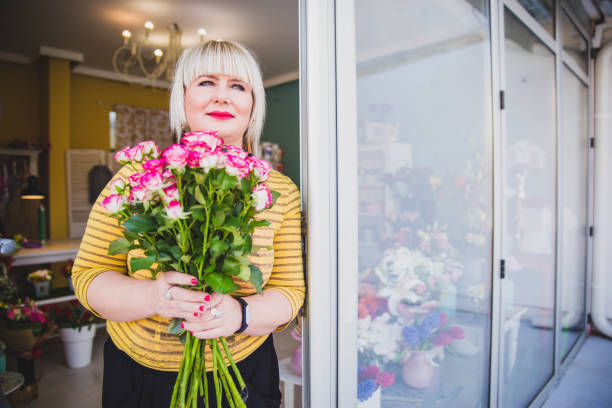 istock Woman holding roses. 1140374275