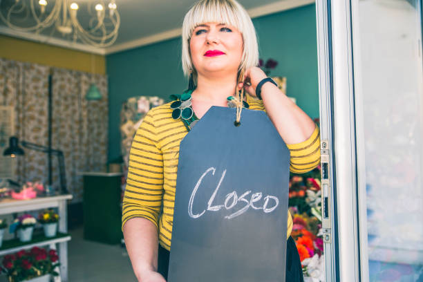 istock Woman with closed sign. 1140374677