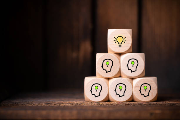istock many people together having an idea symbolized by icons on cubes 1140377797