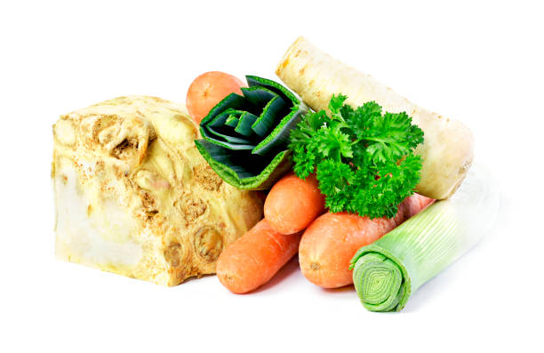 Soup vegetables, isolated on white background. Broth ingredients, celery, parsley, leek and carrots.