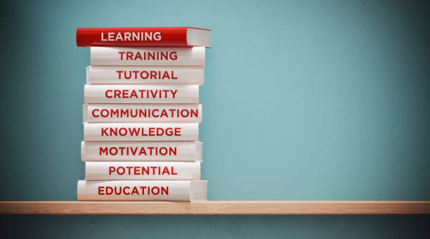 books of  learning and education in front grey wall - success practicing book stack imagens e fotografias de stock