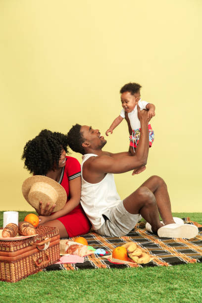 Happy family having picnic at studio