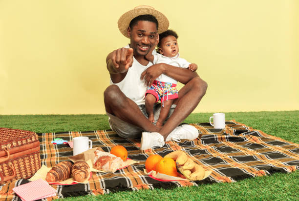 istock Happy family having picnic at studio 1140380415