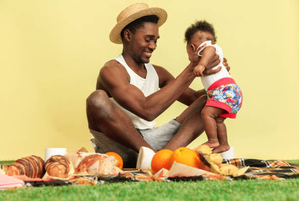 istock Happy family having picnic at studio 1140380417
